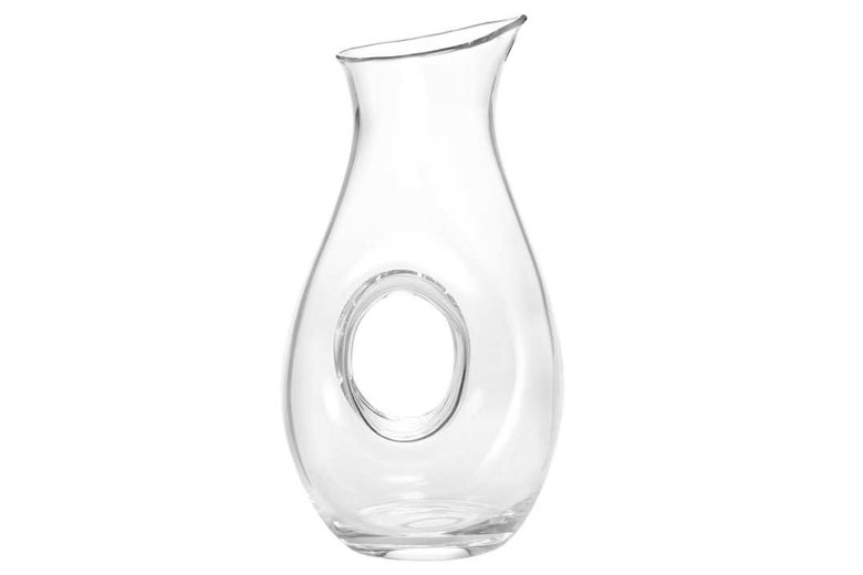 Glass decanter with a hole in the middle.